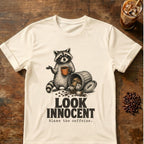 Raccoon coffee graphic for Look Innocent Raccoon on natural T-shirt