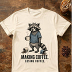Raccoon coffee graphic on a Natural T-shirt