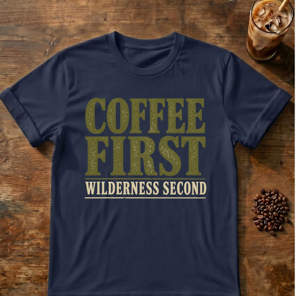 Distressed olive and cream typography reading “Coffee First Wilderness Second”