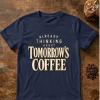 Distressed cream typography reading “Already Thinking About Tomorrow’s Coffee” on a transparent background
