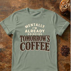 Distressed cream and brown typography reading “Mentally, I’m Already Drinking Tomorrow’s Coffee”