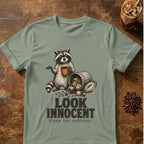 Raccoon coffee graphic for Look Innocent Raccoon on sage T-shirt