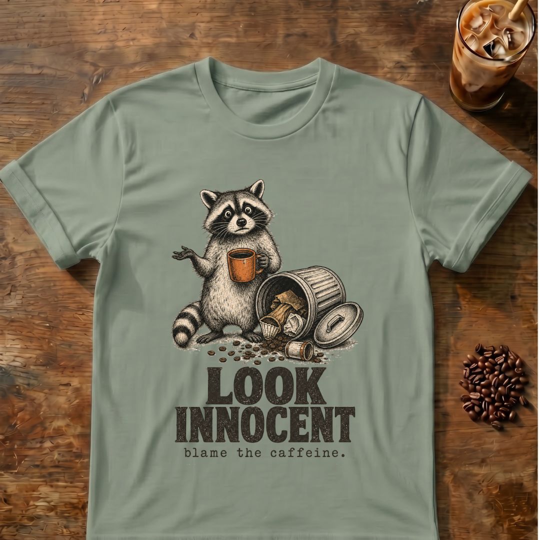 Raccoon coffee graphic for Look Innocent Raccoon on sage T-shirt