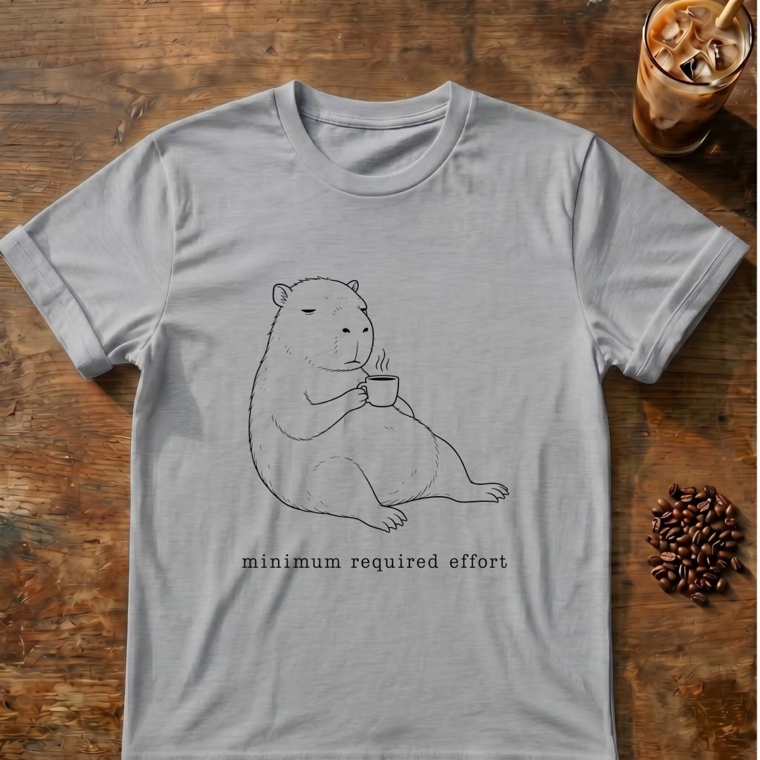 Relaxed capybara holding coffee with “minimum required effort” text graphic