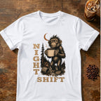 Tired monkey holding a large steaming coffee mug at a moonlit campsite with vertical “Night Shift” text