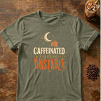 Typography graphic for Caffeinated & Seasonally Unstable on heather-military-green T-shirt